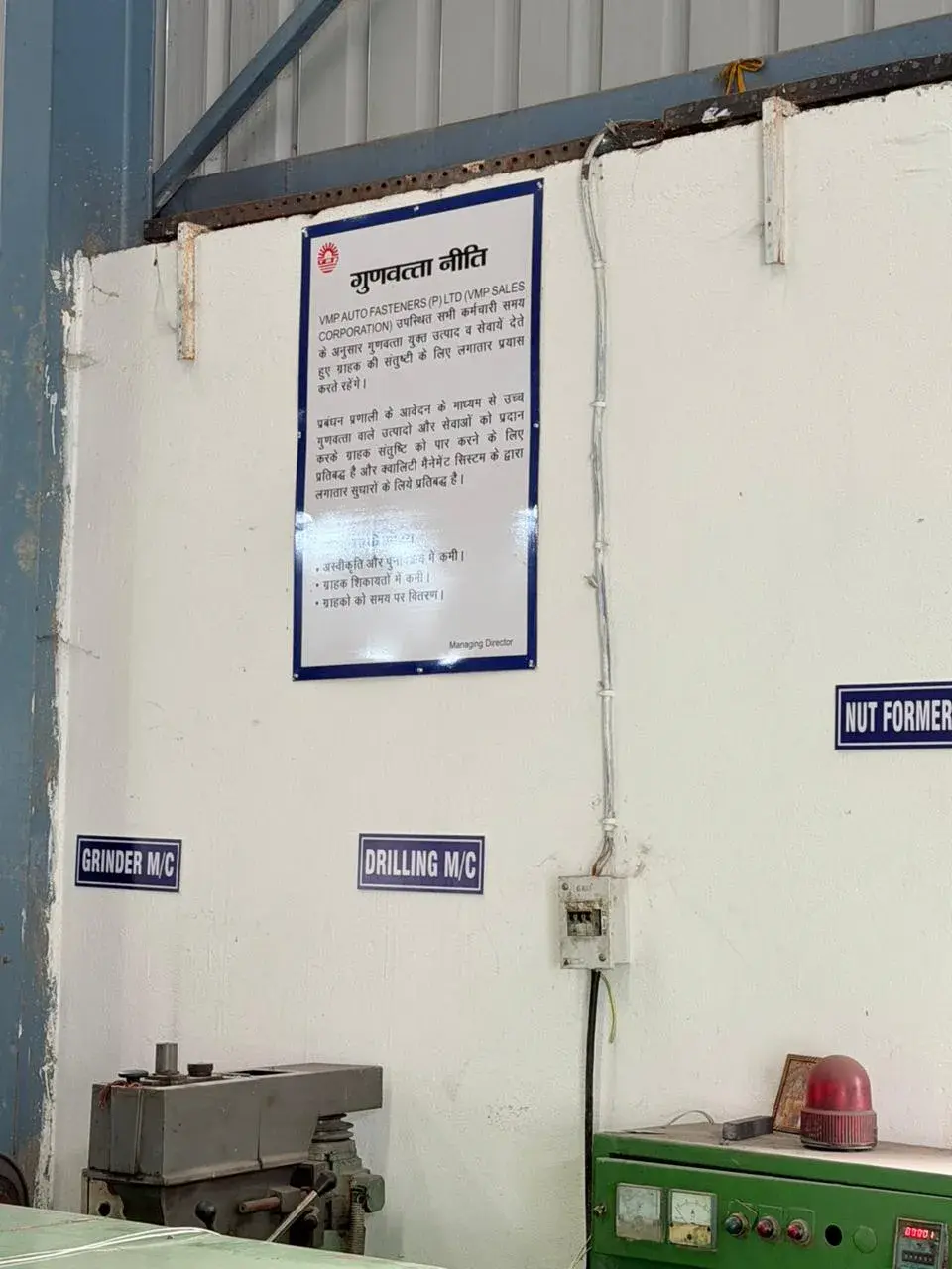 Machine shop with grinder, drilling and nut-former stations